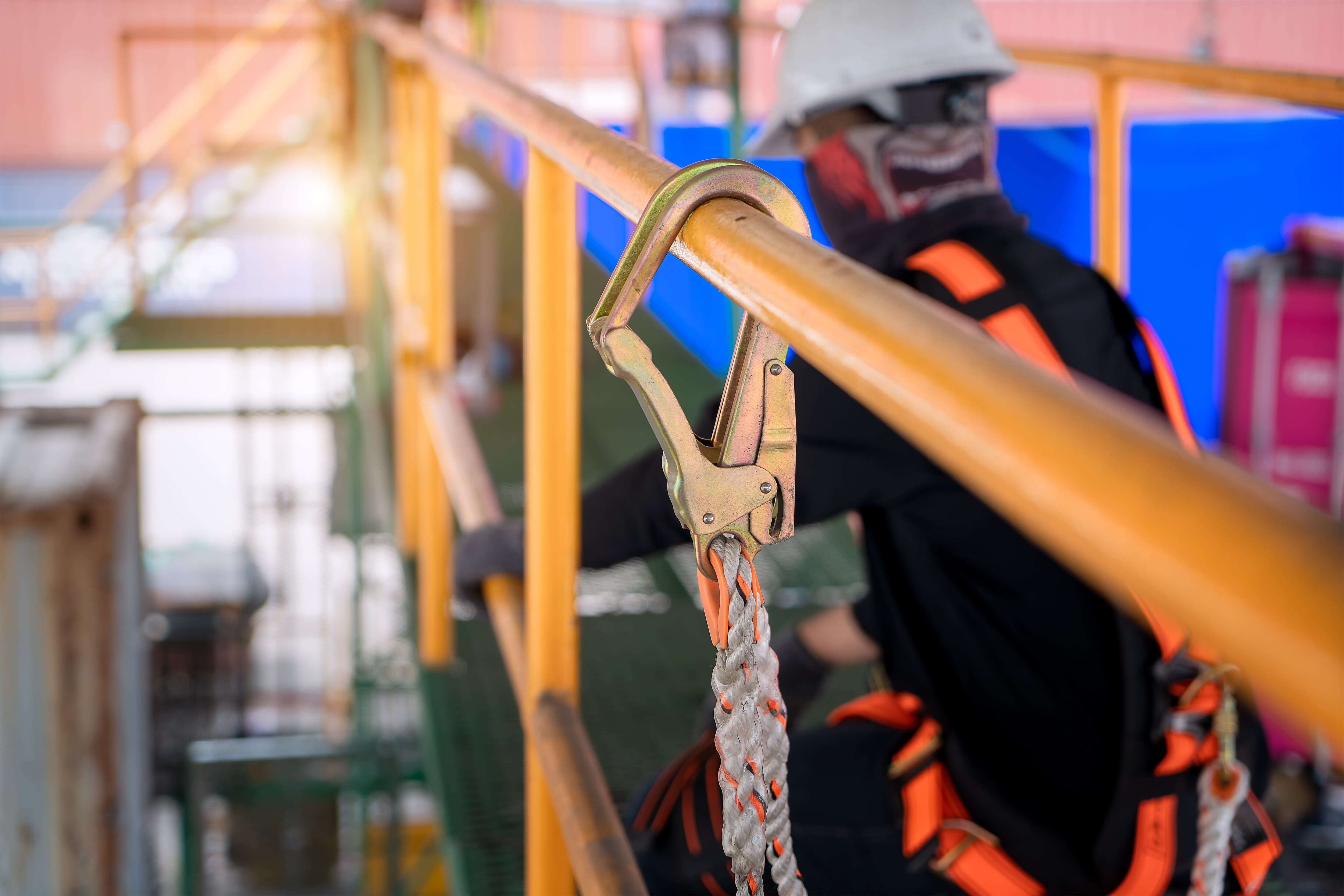 Worker using safety harness